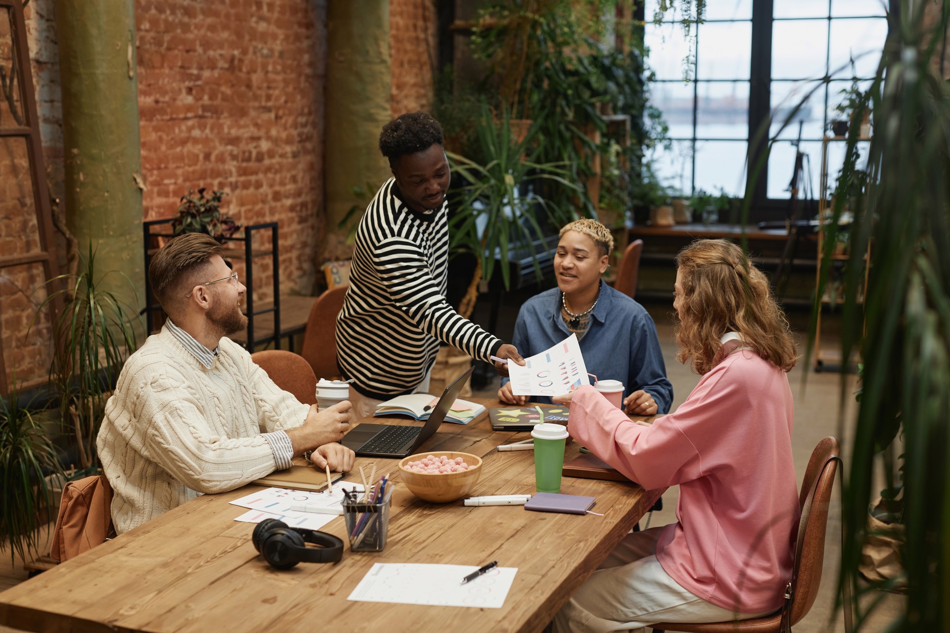 Diverse Young Business Team at Table in Office